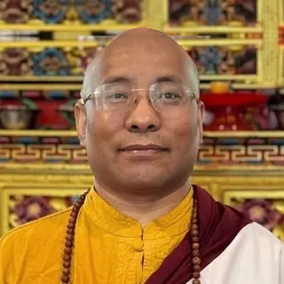 Lama Karma Drodhul seated in the shrine room